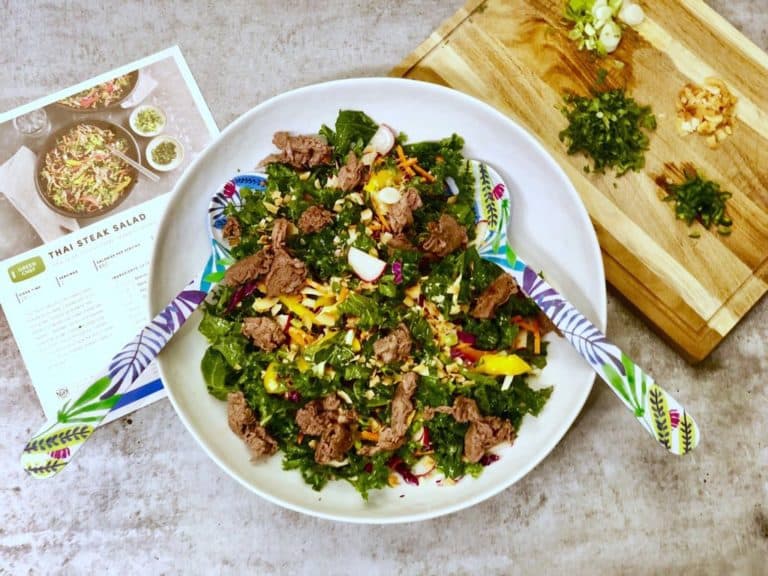 Thai steak salad with kale, coconut flakes and sesame seeds